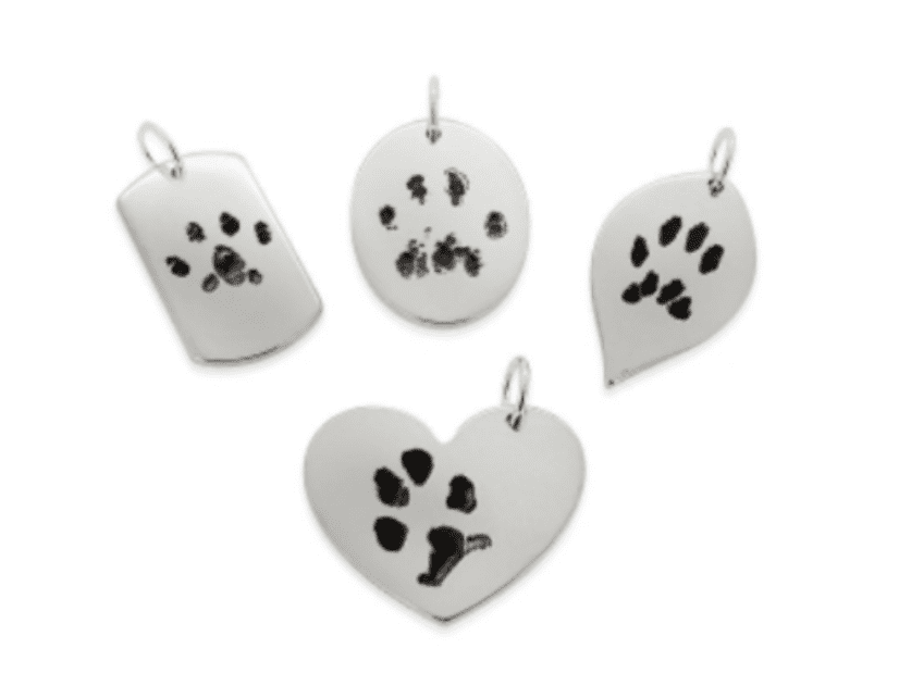 A group of four animal prints on the side of a heart.